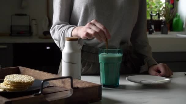 Woman and glass of coffee with milk — Stock Video