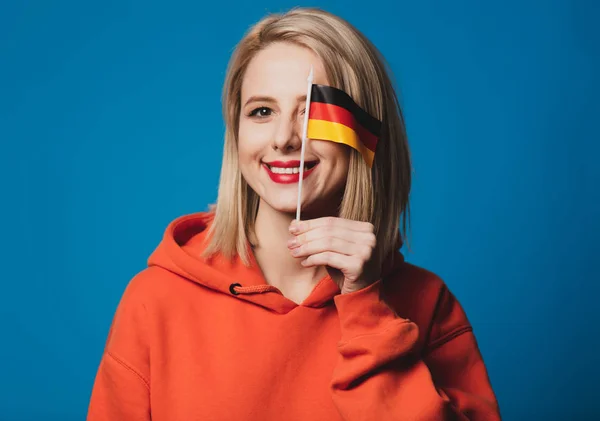 Beatiful Girl Holds Flag Germany Blue Background — Stock Photo, Image