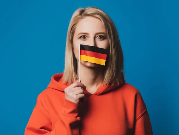 Beatiful Girl Holds Flag Germany Blue Background — Stock Photo, Image