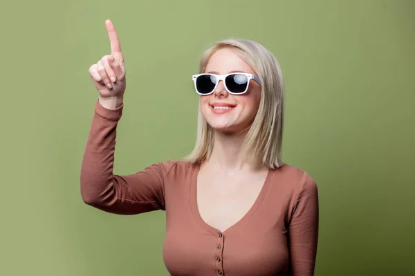 Beautiful blonde girl in a sunglasses and blouse — ストック写真