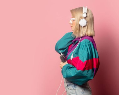 woman in 90s clothes with headphones 