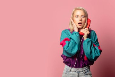 Beautiful blonde woman in 90s clothes with headset 