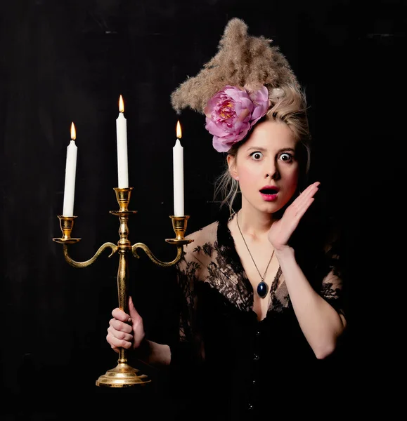 Beautiful blonde countess with a candlestick — ストック写真