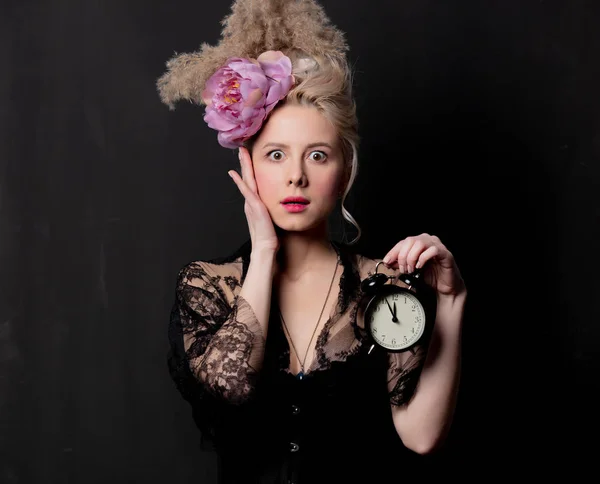 Beautiful blonde countess with alarm clock — 스톡 사진