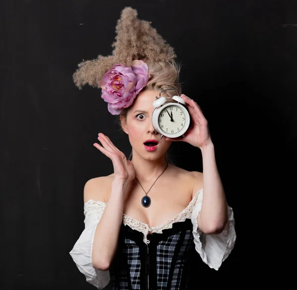 Beautiful blonde countess with alarm clock — ストック写真