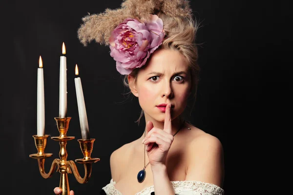 Beautiful blonde countess with a candlestick — ストック写真