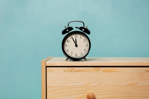 Vintage alarm clock on  bedside table — 스톡 사진