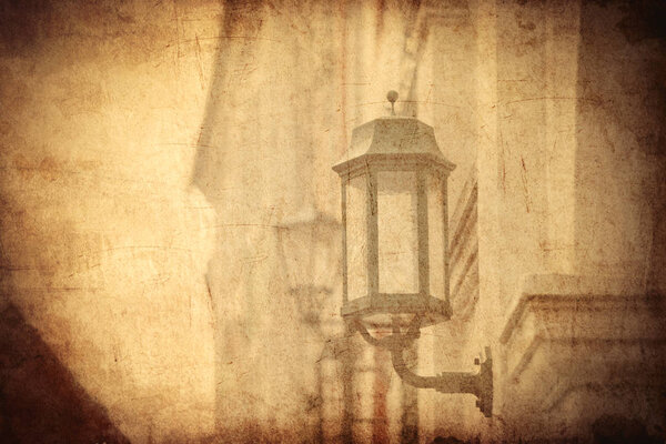 aged street lighting lamp in Germany. Image in old color style 