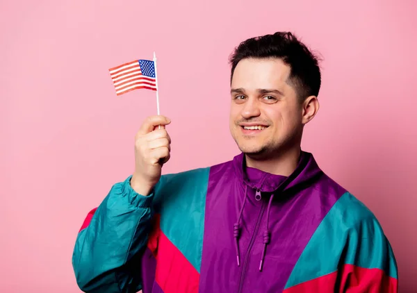 Man in 90s sport suit with little American flag — Stok fotoğraf