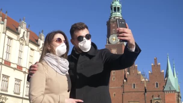 Young Couple Masks Takes Selfie Background Landmark Wroclaw Poland — Stock Video