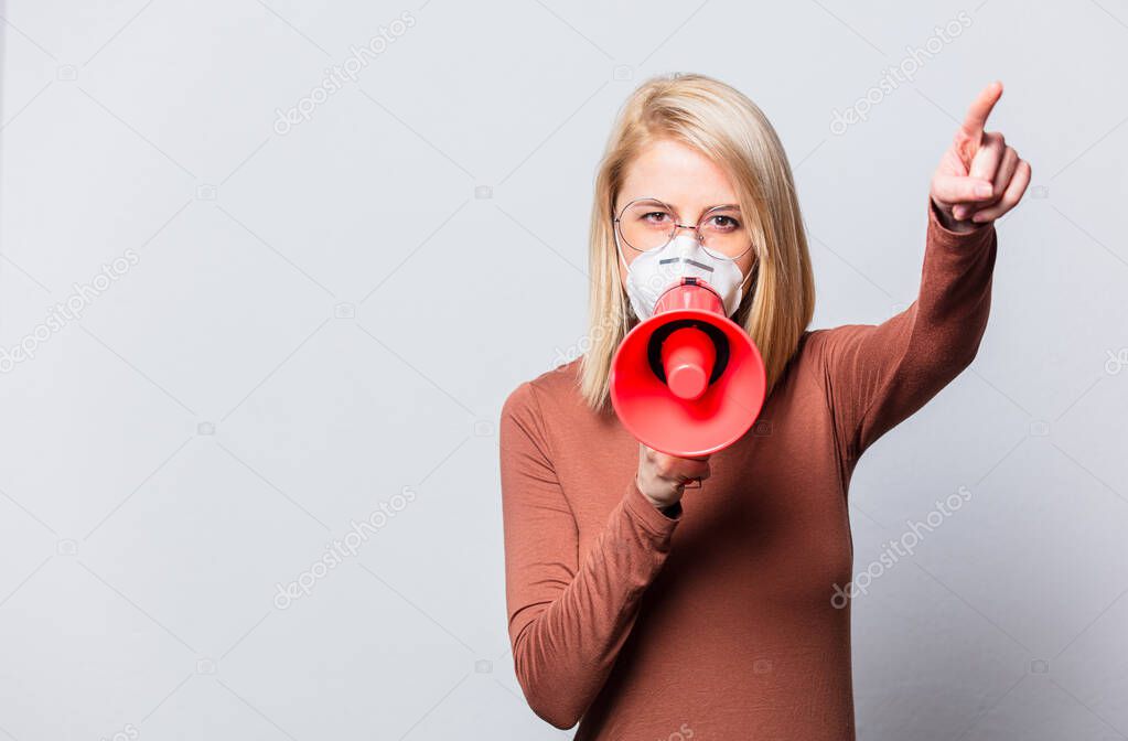 Style blonde woman with red megaphone on white background