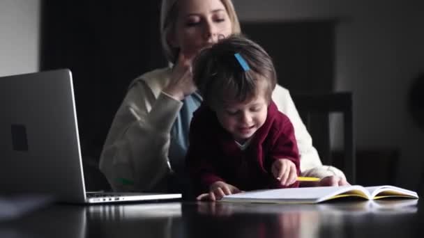 Young Mother Works Computer Home Her Child — Stock Video