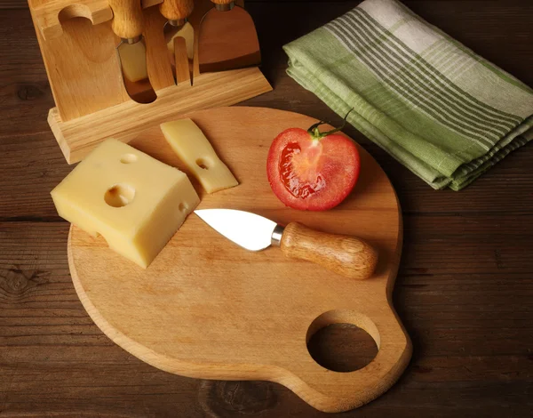 Cheese and a knife — Stock Photo, Image