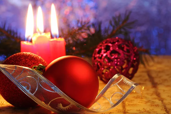 Red Christmas balls and candles — Stock Photo, Image