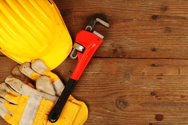 Helmet, gloves and wrench — Stock Photo, Image