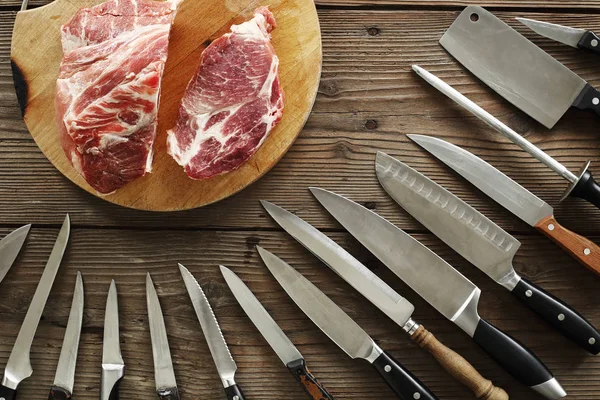 various kitchen knives and meat