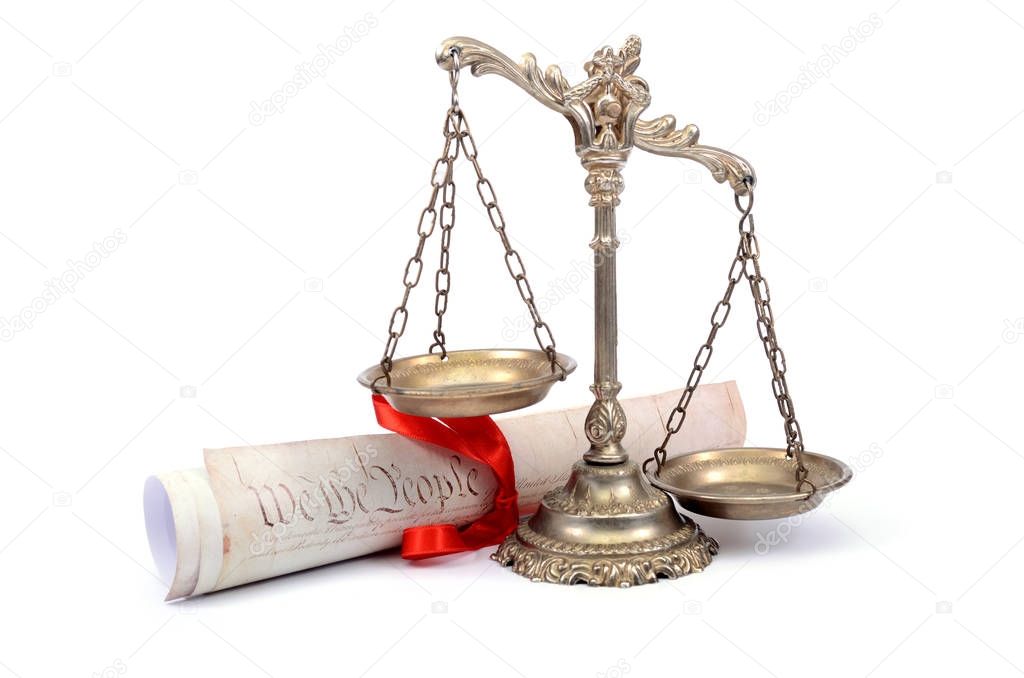 Scales of justice and US Constitution.