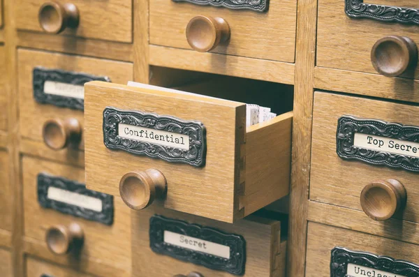 Old wooden archive files catalog drawer.