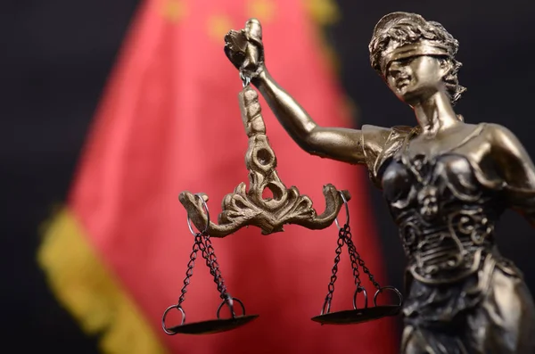 Scales of Justice, Justitia, Lady Justice in front of the flag o