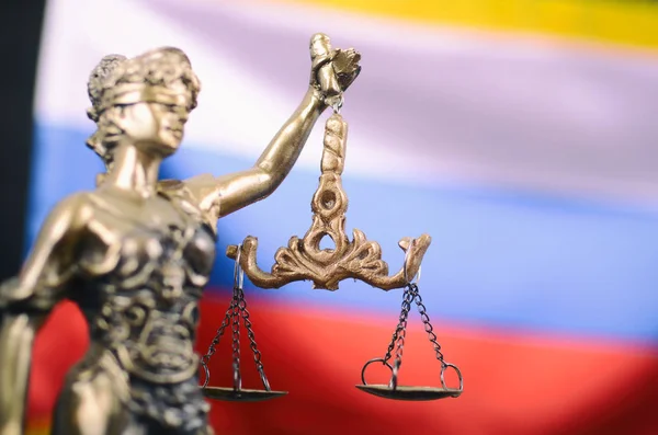 Scales of Justice, Justitia, Lady Justice in front of the Russian flag.