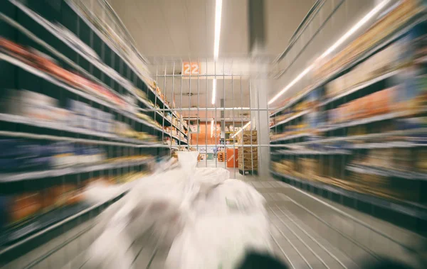 Supermarket shopping cart in move, view from shopping cart. — Stock Photo, Image