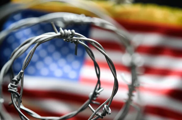 Barbed wire and United States of America flag , immigration stock concept — ストック写真