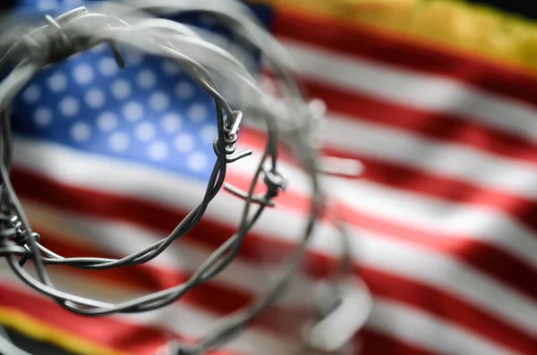 Barbed wire and United States of America flag , immigration stock concept — ストック写真