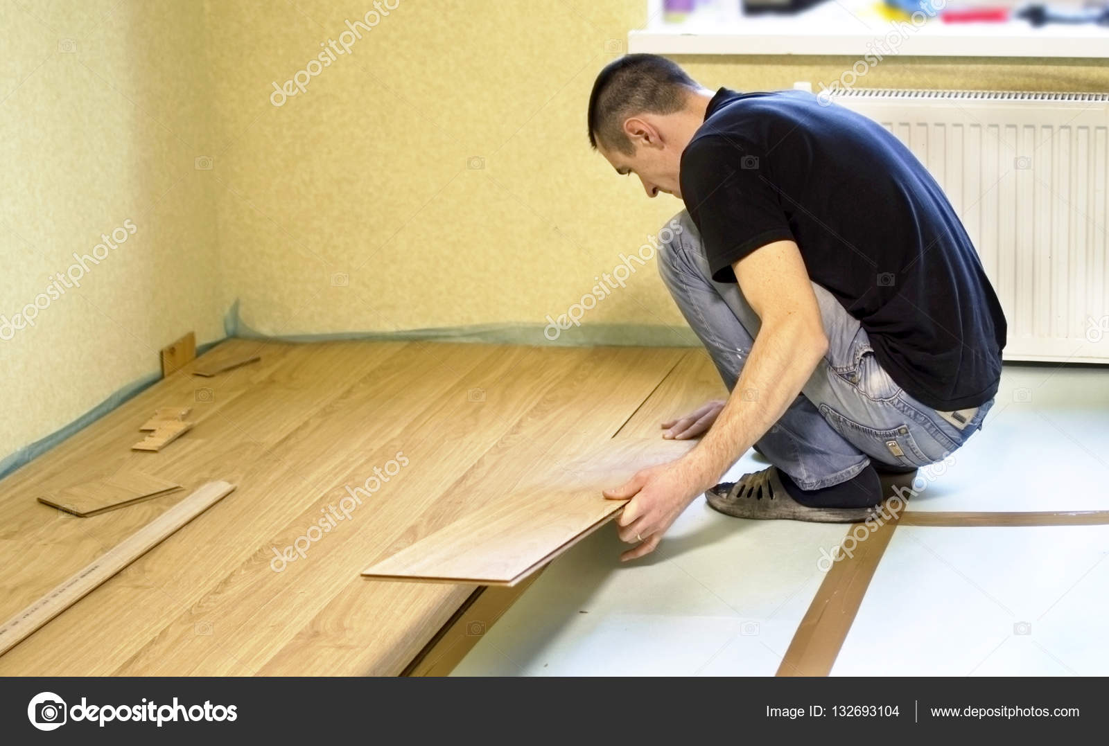 The Process Of Installing Laminate Wooden On Floor Stock Photo The Process Of Installing Laminate Wooden On Floor Stock Photo