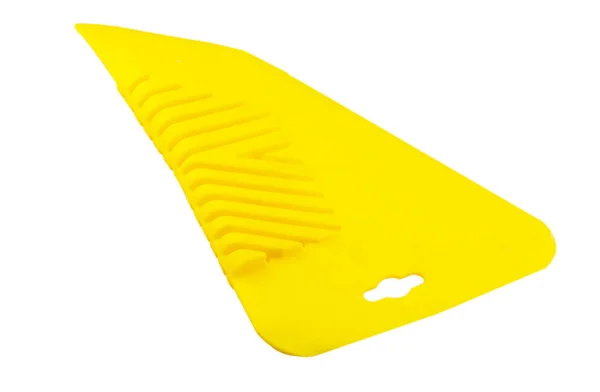 Yellow Spatula for gluing wallpaper — Stock Photo, Image