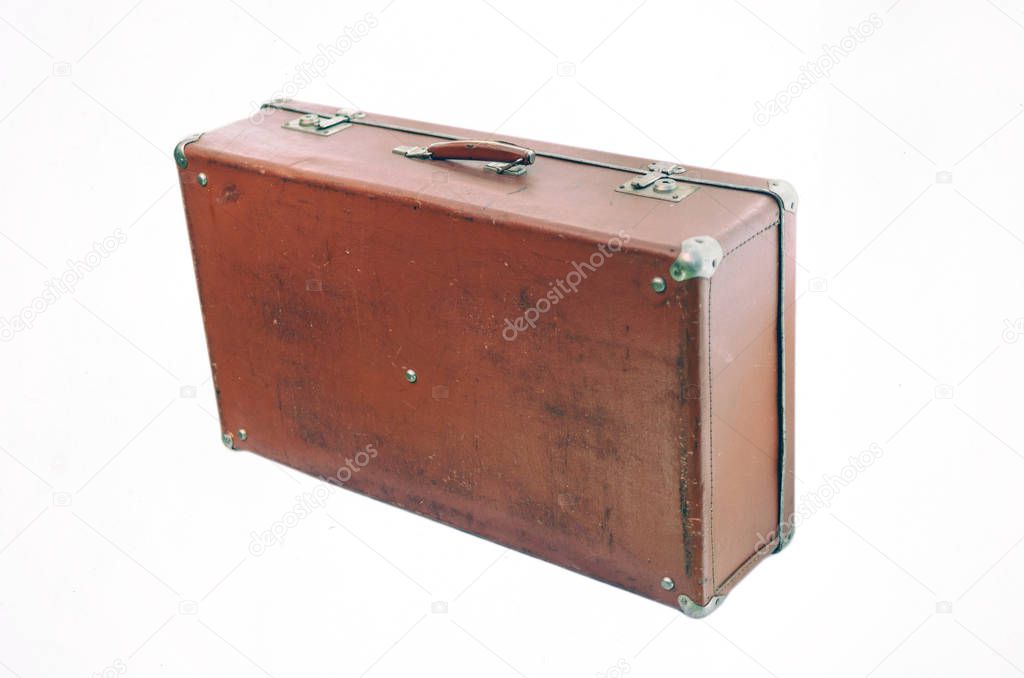 Standing at an angle leather old suitcase isolated on white back