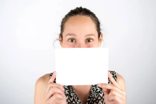 Woman hidden behind empty board — Stock Photo, Image