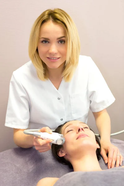 Young girl doing massage — Stock Photo, Image