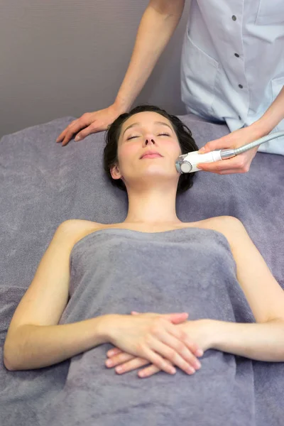 Young girl doing massage — Stock Photo, Image