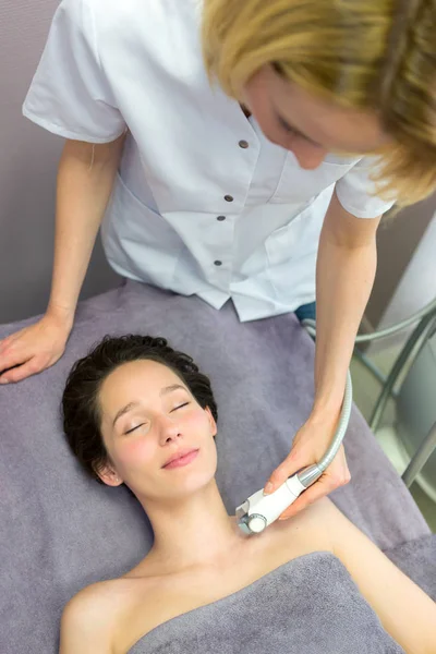 Young girl doing massage — Stock Photo, Image