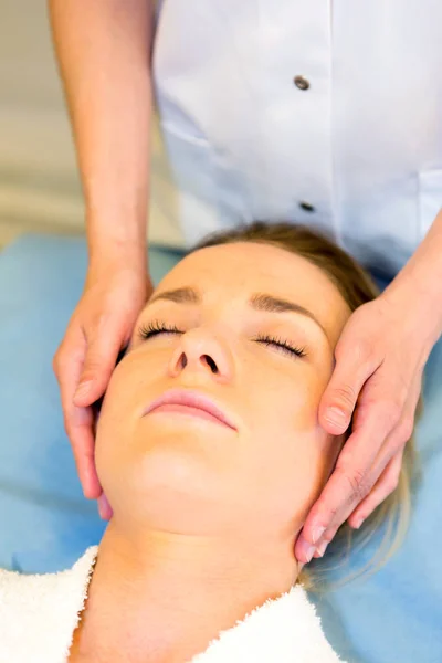 Young girl doing massage — Stock Photo, Image