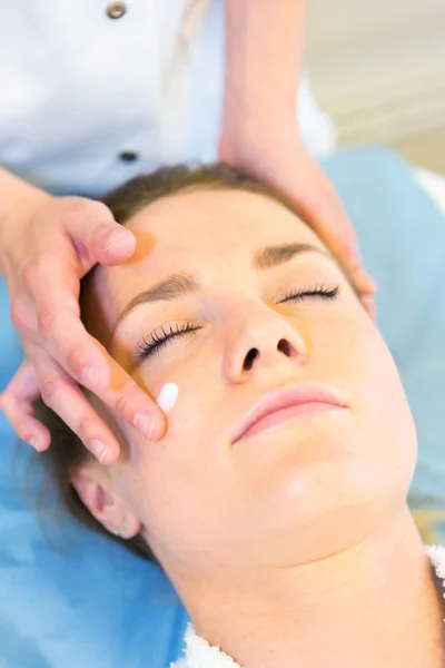 Young girl doing massage — Stock Photo, Image