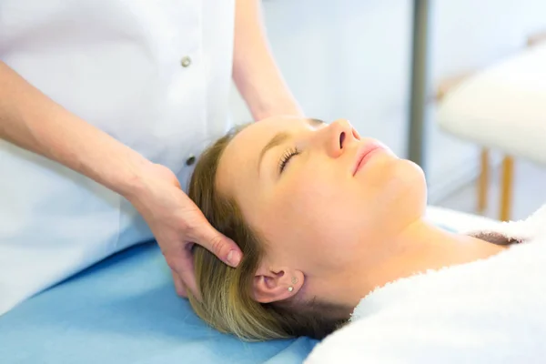 Young girl doing massage — Stock Photo, Image