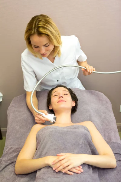 Young girl doing massage — Stock Photo, Image