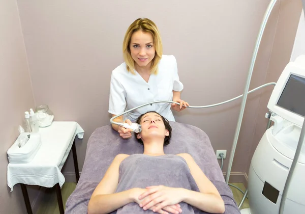 Young girl doing massage — Stock Photo, Image