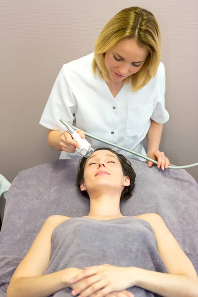 Young girl doing massage — Stock Photo, Image