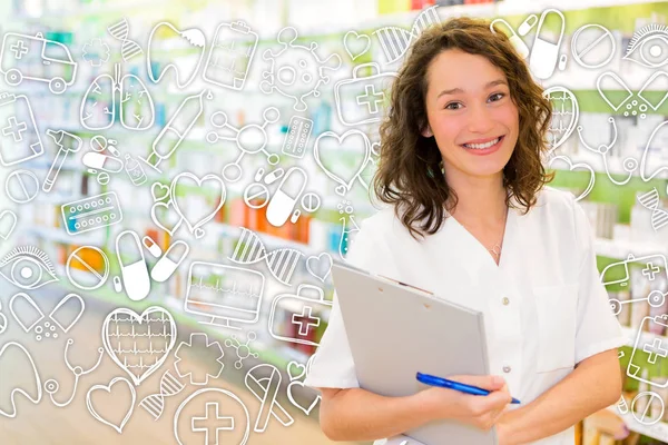 Atractivo farmacéutico tomando notas en el trabajo —  Fotos de Stock