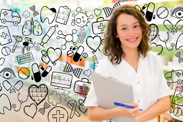 Attractive pharmacist taking notes at work — Stock Photo, Image