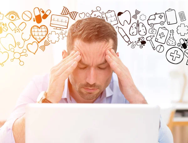 Businessman got headache because of burn out surrounded by icons — Stock Photo, Image