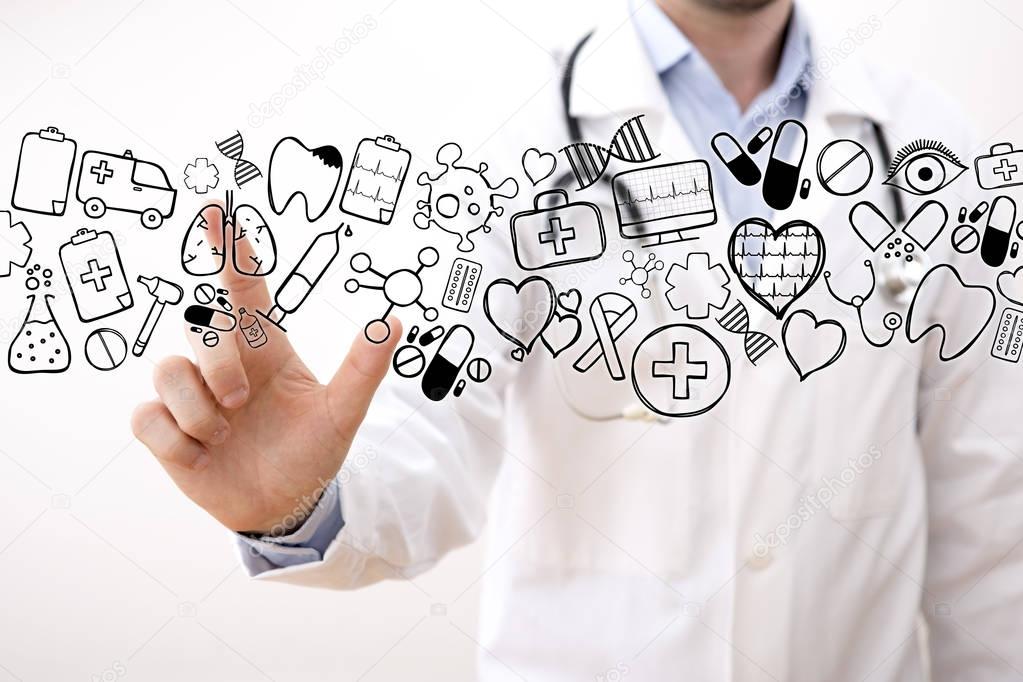 Professional Doctor pointing graph icons with his finger 