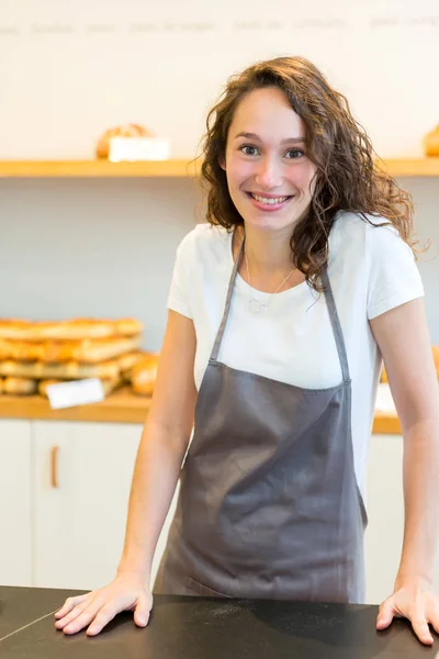 Woman baker working at the bakery — Stock Photo, Image