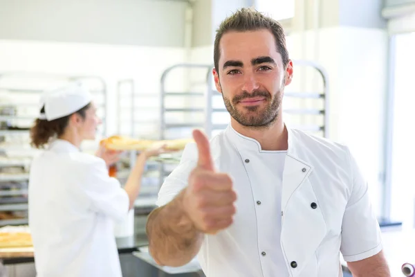 Bakers working at the bakery — Stock Photo, Image