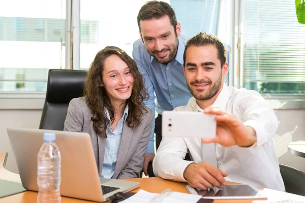 View of a Group of business associates working together at the office — Stock Photo, Image