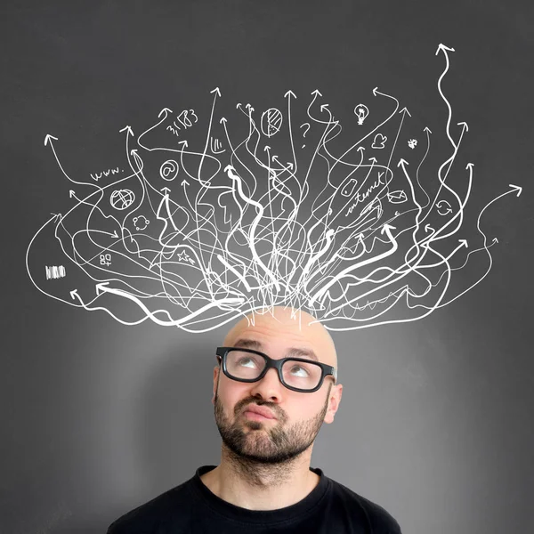 Man with brainstorming arrows over head Royalty Free Stock Photos