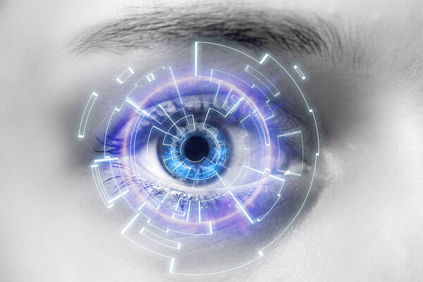 Eye of a woman with digital interface