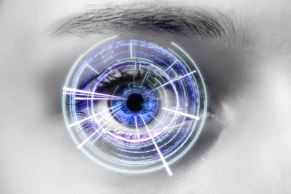 Eye of a woman with digital interface